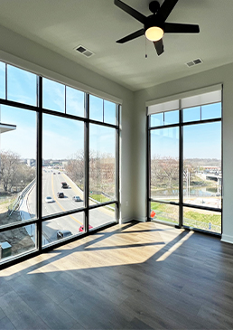 East Bank living room windows ceiling to floor.