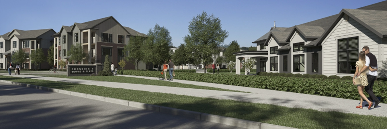 A couple with arms around each other walking past apartment buildings