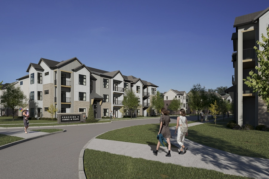 Not all Noblesville apartment communities offer coach homes like Crossing 5 does. Two women walking through an apartment community