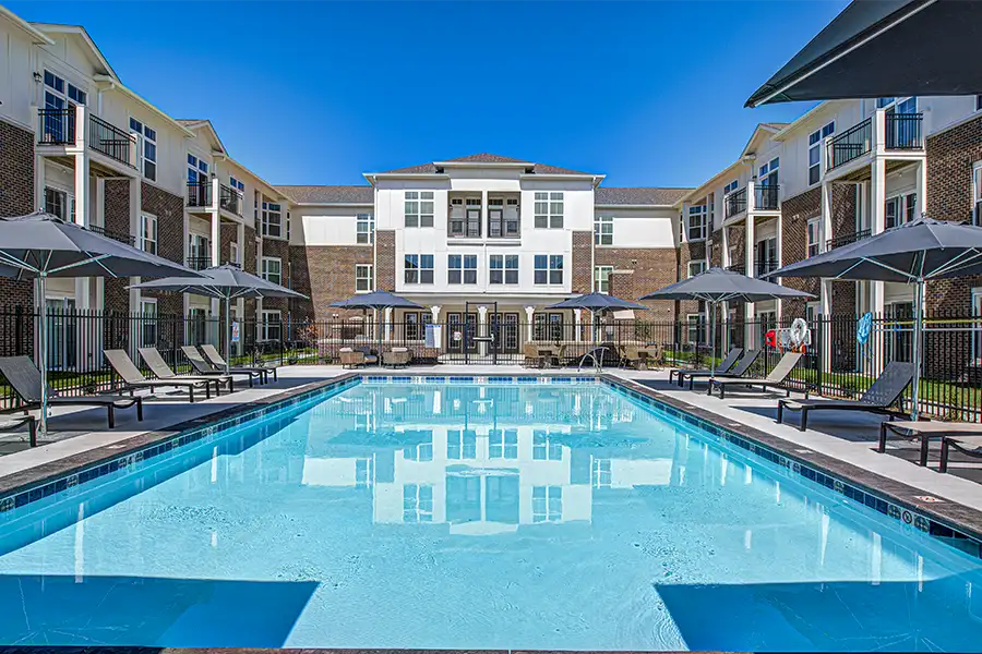 Pristine pool surrounded by apartment buildings at East Bank Apartments.